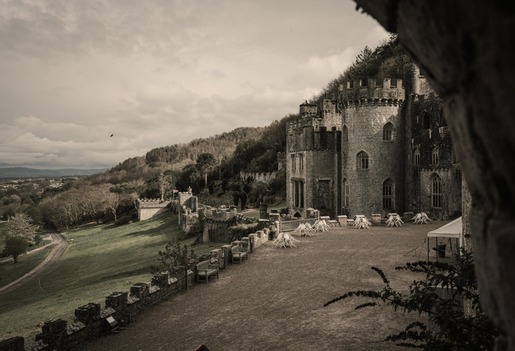 The backdrop of a castle-style structure in the UK countryside.